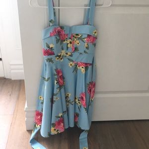 Blue dress with pink and yellow floral designs.